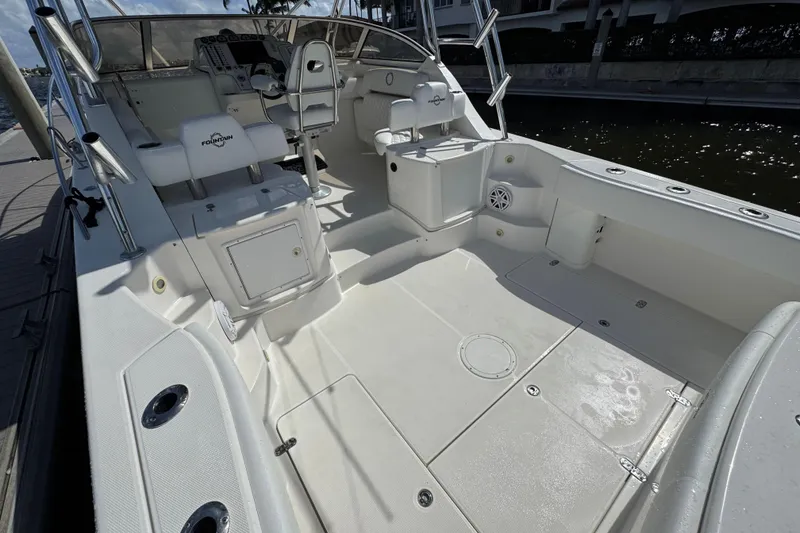 Slide: The Image of 2007 Fountain 33 Sportfish Cruiser boat interior with seating and control panel. - 9