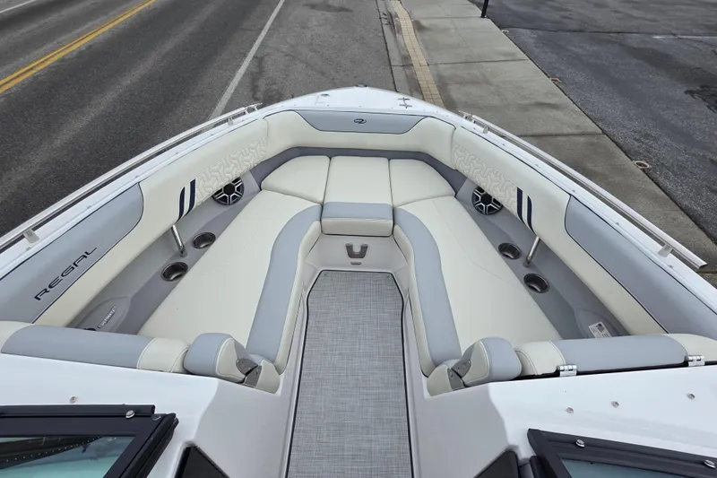 Slide: The Image of 2026 Regal LS6 boat interior with luxurious seating and modern design. - 11