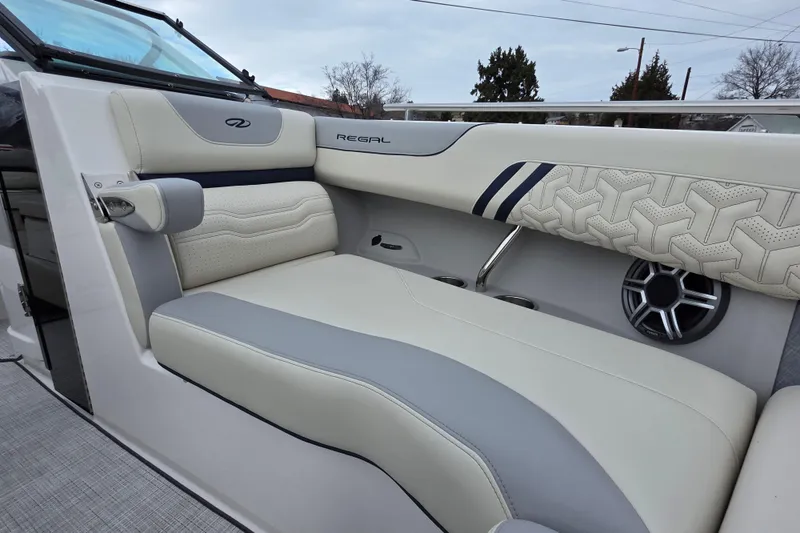 Slide: The Image of 2026 Regal LS6 boat interior with luxurious seating and modern speaker system. - 14