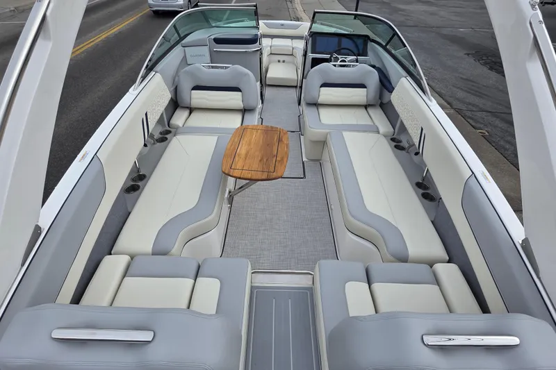 Slide: The Image of Luxurious 2026 Regal LS6 boat interior with spacious seating and elegant wooden table. - 5