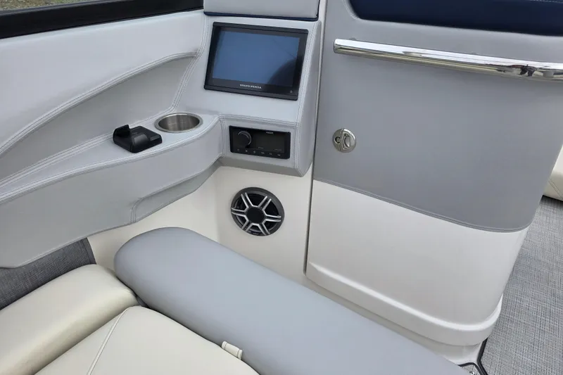 Slide: The Image of Interior of 2026 Regal LS6 boat featuring control panel and speaker system. - 8