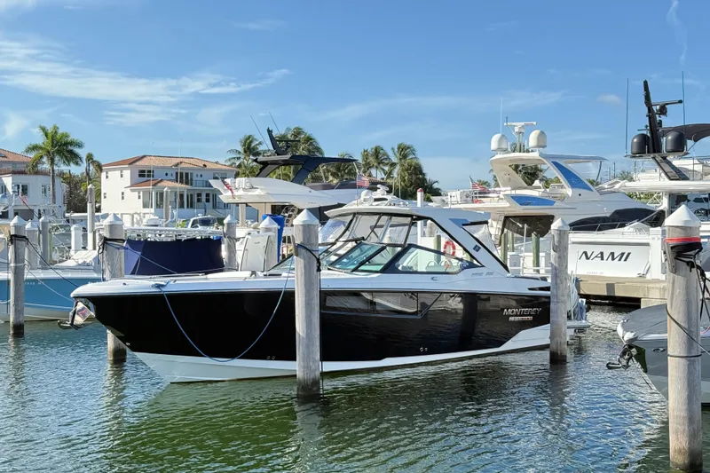 The Image of 2022 Monterey 385SS Super Sport boat docked at a marina with clear skies. - 0