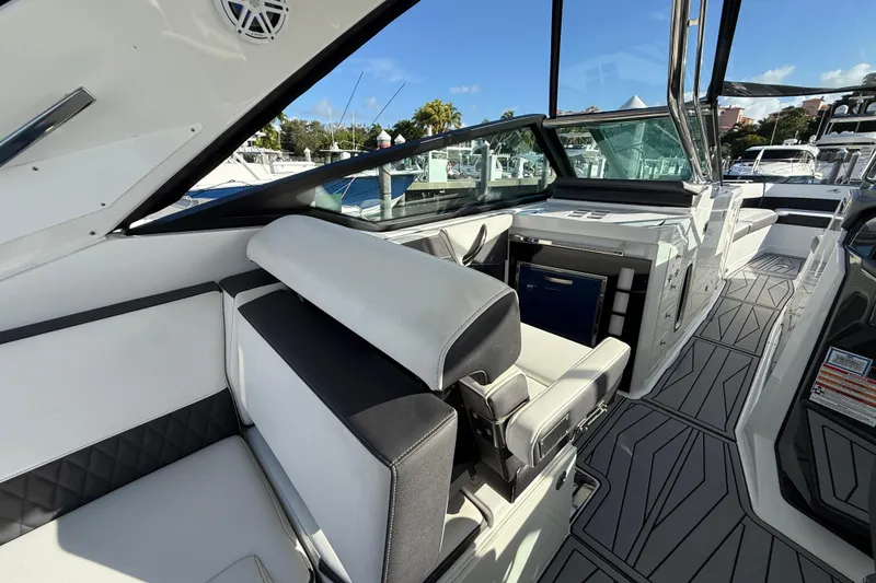 Slide: The Image of 2022 Monterey 385SS Super Sport boat interior with modern seating and sleek design. - 15