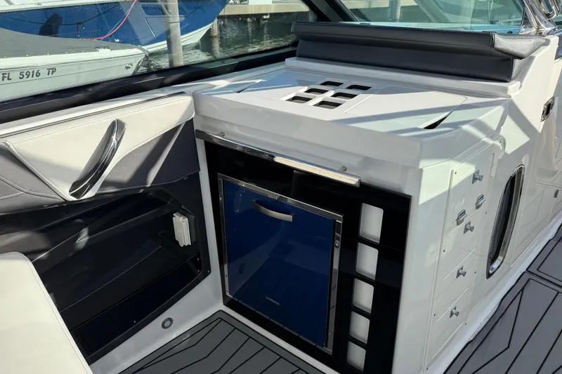 Slide: The Image of 2022 Monterey 385SS Super Sport boat interior with sleek cabinetry and modern design. - 17