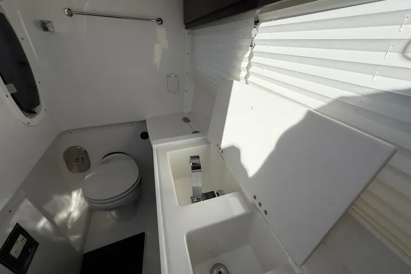 Slide: The Image of 2022 Monterey 385SS Super Sport bathroom interior with toilet and sink. - 34