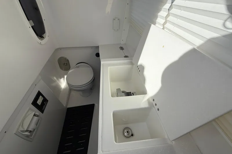 Slide: The Image of 2022 Monterey 385SS Super Sport boat bathroom with toilet and sink. - 35