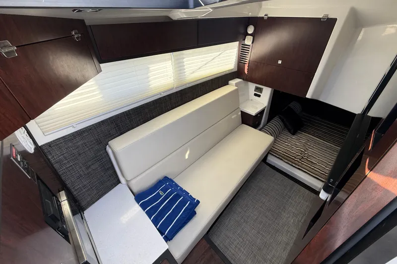 Slide: The Image of 2022 Monterey 385SS Super Sport interior with sofa, bed, and modern cabinetry. - 36