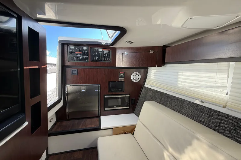 Slide: The Image of Interior of 2022 Monterey 385SS Super Sport boat with modern amenities and sleek design. - 42