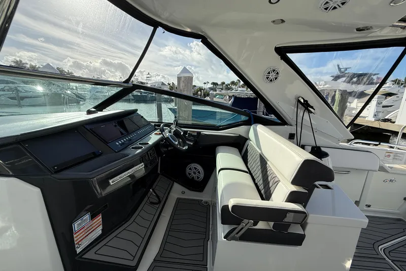Slide: The Image of 2022 Monterey 385SS Super Sport boat interior with modern dashboard and seating. - 45