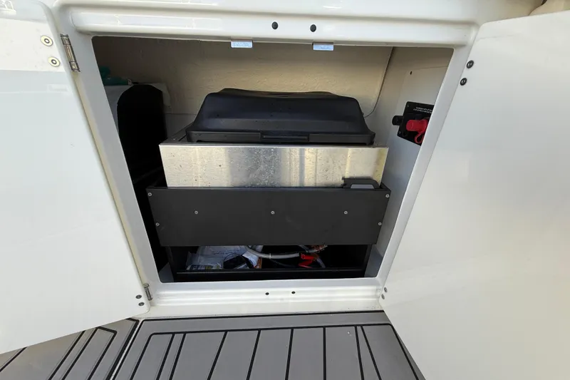 Slide: The Image of 2022 Monterey 385SS Super Sport storage compartment with equipment inside. - 9