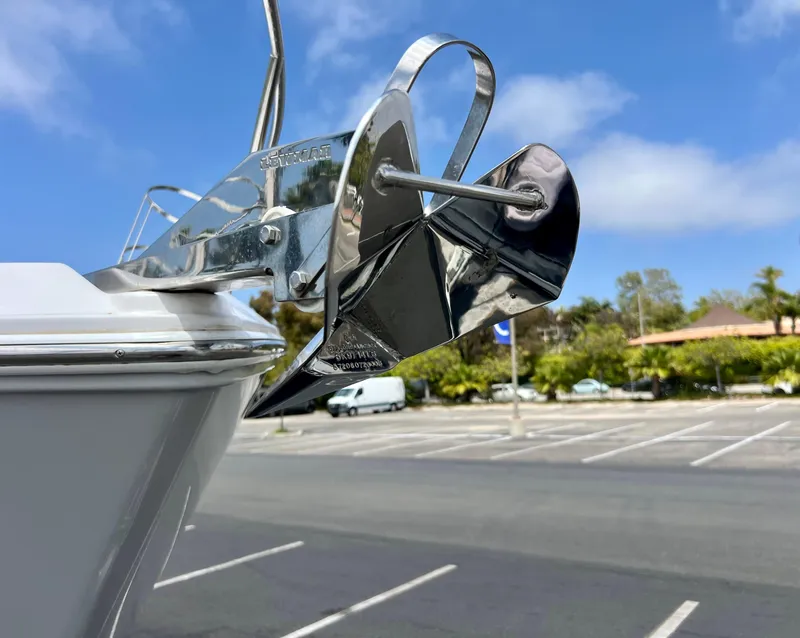 Slide: The Image of 2019 Regal 26 XO boat anchor detail in a parking lot setting. - 14