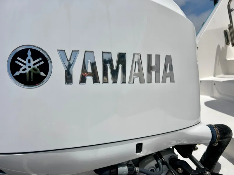Slide: The Image of Close-up of Yamaha logo on a 2019 Regal 26 XO boat engine. - 16