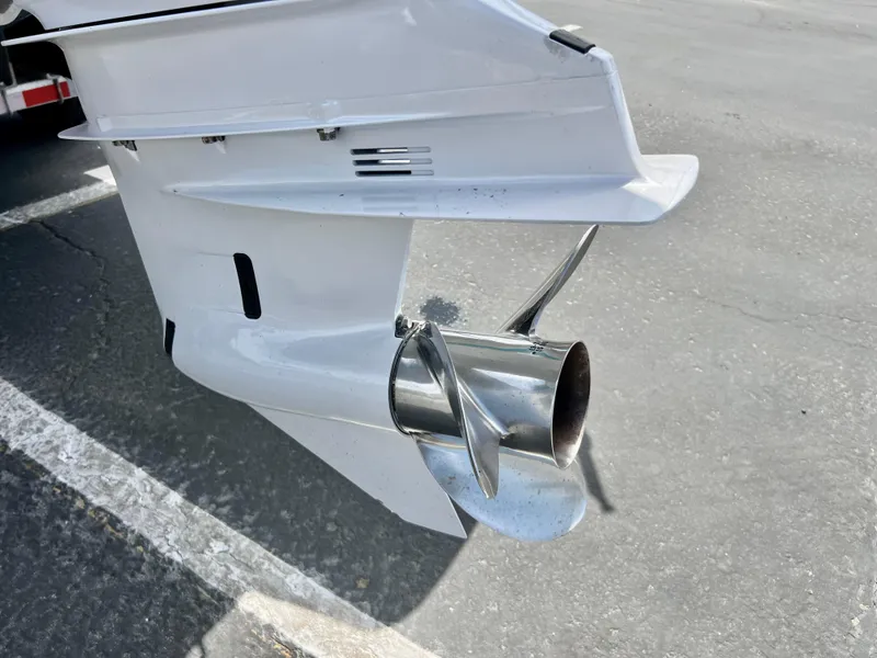 Slide: The Image of 2019 Regal 26 XO boat propeller and outdrive on pavement. - 17