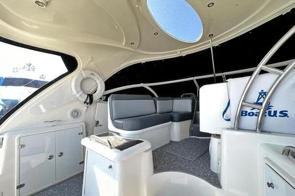 Slide: The Image of Interior of a 2005 Cruisers 420 yacht with modern seating and sleek design. - 10