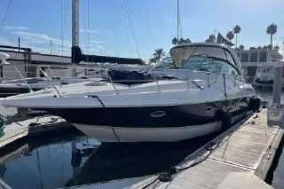 Slide: The Image of 2005 Cruisers 420 yacht docked at marina under clear blue sky. - 3