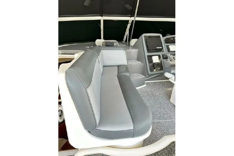 Slide: The Image of 2005 Cruisers 420 yacht interior with gray seating and modern dashboard. - 35