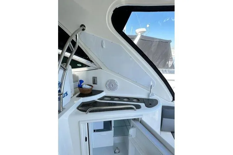 Slide: The Image of 2005 Cruisers 420 yacht interior with sleek kitchenette and modern design elements. - 36