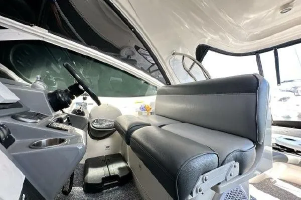 Slide: The Image of Interior of 2005 Cruisers 420 boat with steering wheel and seating area. - 37