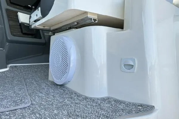 Slide: The Image of 2005 Cruisers 420 interior with speaker and carpeted flooring. - 50