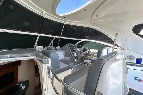 Slide: The Image of 2005 Cruisers 420 yacht interior with modern helm and seating area. - 51