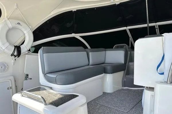 Slide: The Image of Interior of 2005 Cruisers 420 yacht with gray seating and life preserver. - 9