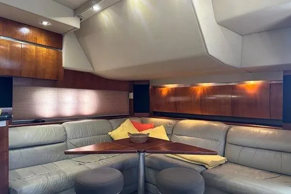 Slide: The Image of Luxurious 2005 Cruisers 420 yacht interior with leather seating and wooden accents. - 13