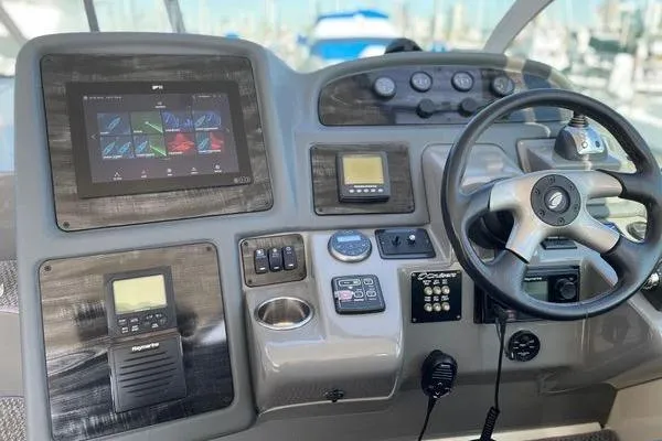 Slide: The Image of Helm of 2005 Cruisers 420 yacht with modern navigation and control systems. - 4