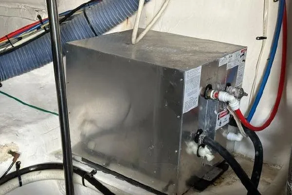 Slide: The Image of Engine room of 2005 Cruisers 420 yacht with water heater and hoses. - 40