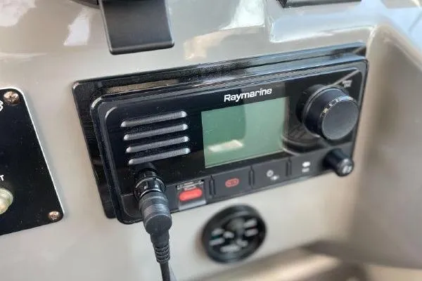 Slide: The Image of Raymarine marine radio on 2005 Cruisers 420 boat dashboard. - 5