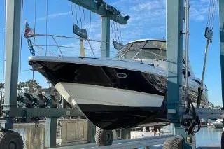 Slide: The Image of 2005 Cruisers 420 yacht in dry dock, showcasing sleek design and modern features. - 53