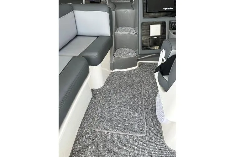 Slide: The Image of 2005 Cruisers 420 interior with gray seating and carpeted flooring. - 62