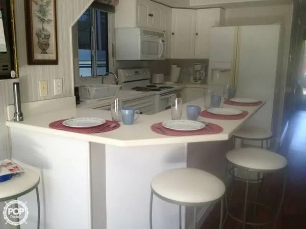 Slide: The Image of Fiberglass Unlimited 56 Catamaran Houseboat 2000 - 2