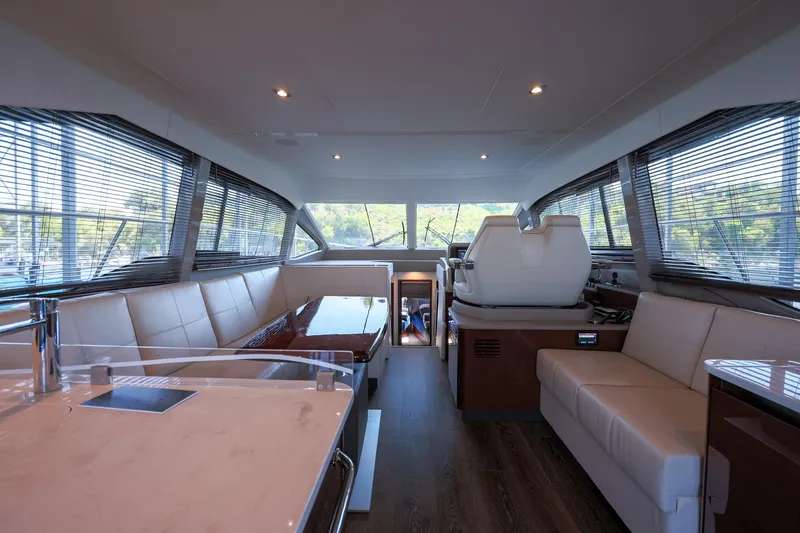 Slide: The Image of Luxurious interior of 2018 Sea Ray Fly 460 yacht with modern seating and helm. - 23