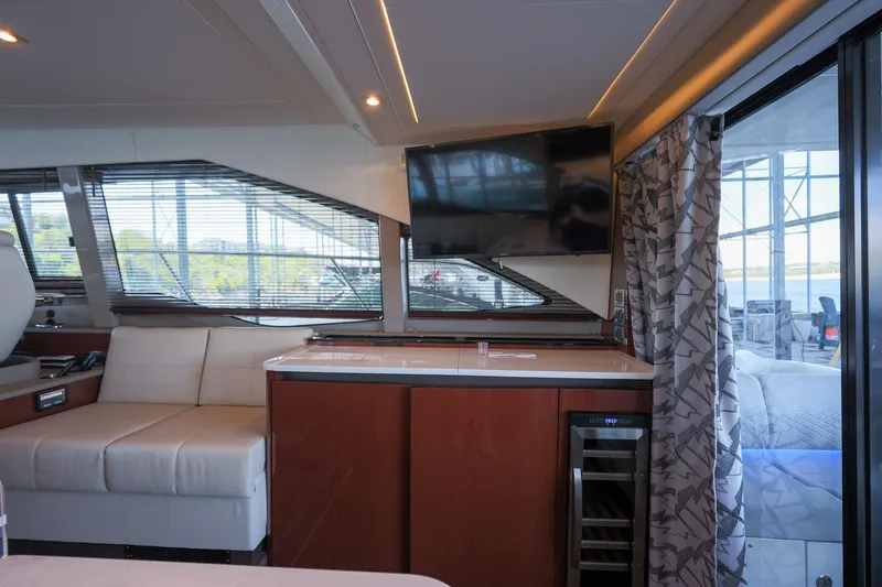 Slide: The Image of Luxurious interior of 2018 Sea Ray Fly 460 yacht with modern furnishings and large windows. - 25