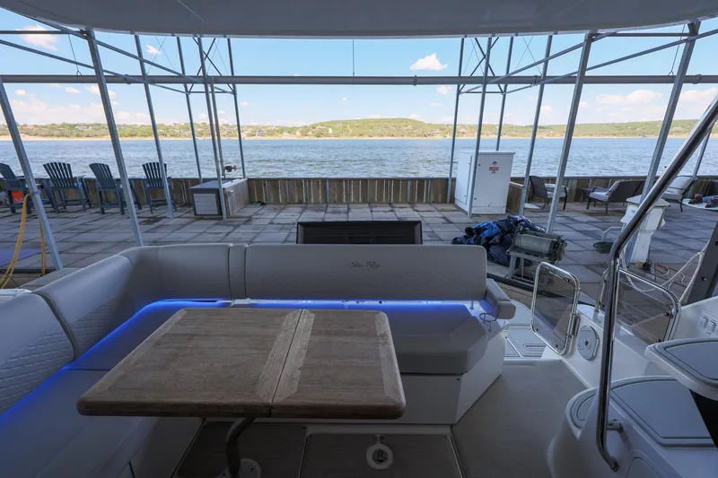 Slide: The Image of 2018 Sea Ray Fly 460 yacht interior with lake view and outdoor seating area. - 27