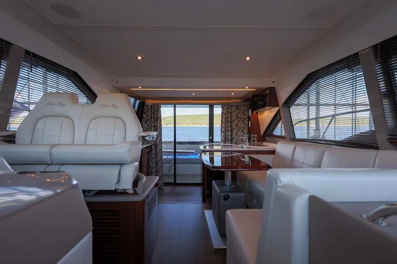 Slide: The Image of Luxurious interior of 2018 Sea Ray Fly 460 yacht with elegant seating and panoramic windows. - 39