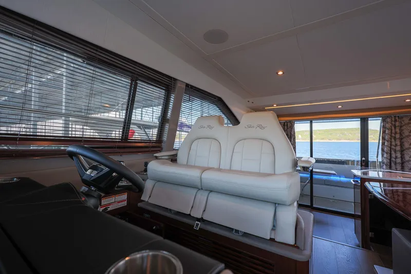 Slide: The Image of Interior of 2018 Sea Ray Fly 460 yacht with luxurious seating and panoramic windows. - 40