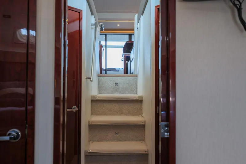 Slide: The Image of Interior staircase of 2018 Sea Ray Fly 460 yacht, featuring elegant design and wood accents. - 44
