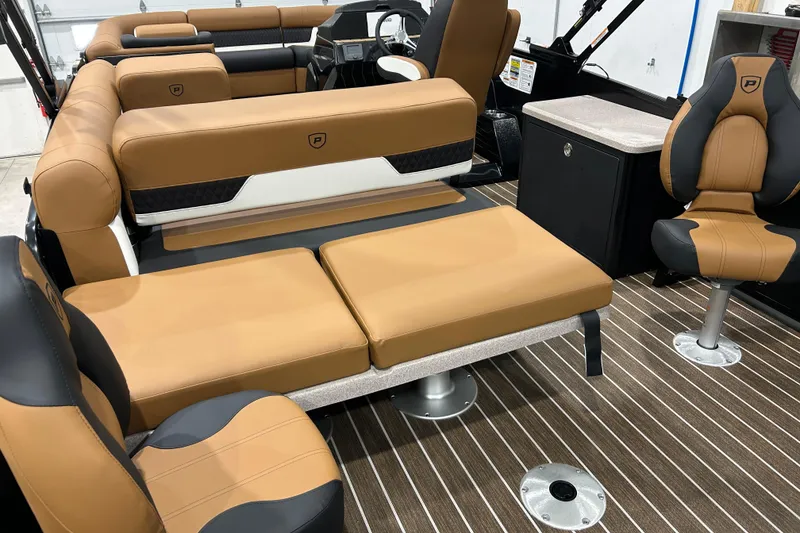 Slide: The Image of Luxurious interior of 2026 Premier 250 Solaris RS boat with tan and black seating. - 18