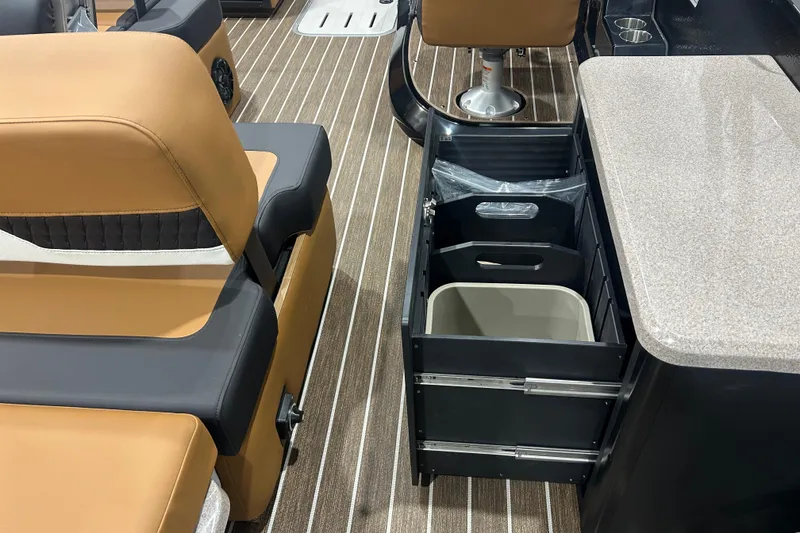 Slide: The Image of Interior of 2026 Premier 250 Solaris RS boat with seating and storage compartments. - 25