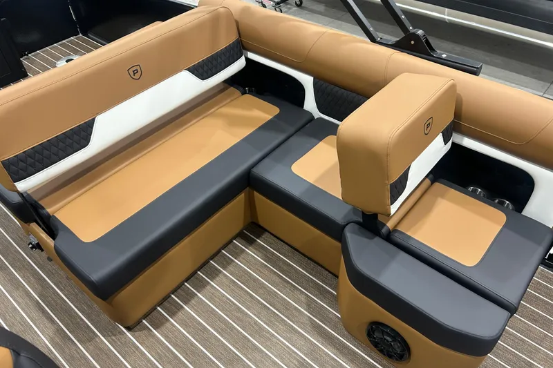 Slide: The Image of Luxurious seating in 2026 Premier 250 Solaris RS boat with tan and black upholstery. - 27