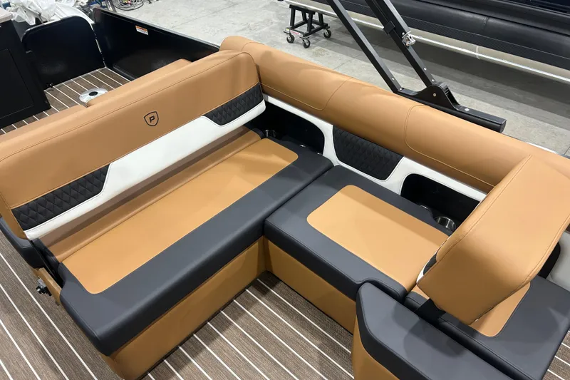 Slide: The Image of Luxurious seating in 2026 Premier 250 Solaris RS boat, featuring tan and black upholstery. - 28