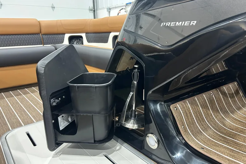 Slide: The Image of Interior of 2026 Premier 250 Solaris RS boat with storage compartment and seating. - 32