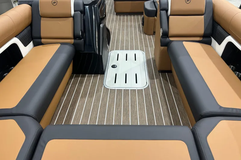 Slide: The Image of Luxurious interior of 2026 Premier 250 Solaris RS boat with tan and black seating. - 38