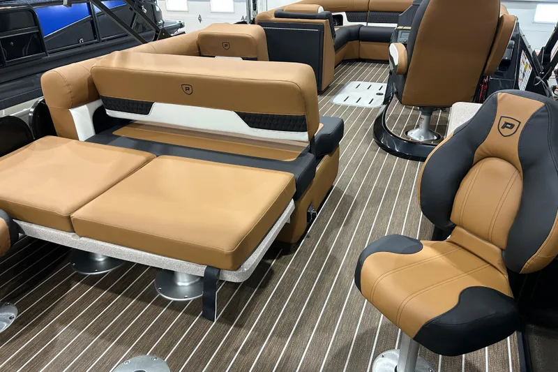 Slide: The Image of 2026 Premier 250 Solaris RS pontoon boat in showroom, featuring sleek design and modern amenities. - 4