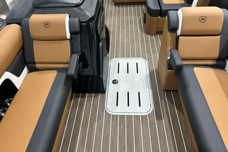 Slide: The Image of Luxurious interior of 2026 Premier 250 Solaris RS boat with tan and black seating. - 40