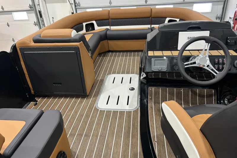 Slide: The Image of 2026 Premier 250 Solaris RS pontoon boat in a garage setting. - 7