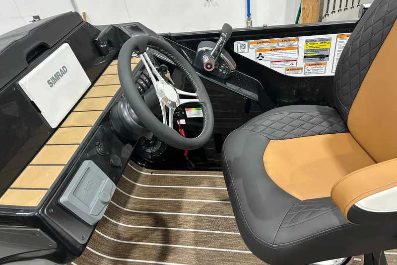 Slide: The Image of 2026 Premier 250 Solaris RS pontoon boat in a garage, showcasing sleek design and modern features. - 8