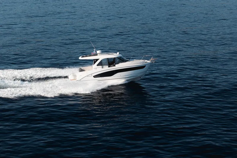 Slide: The Image of 2027 Beneteau Antares 9 V2 cruising on open water, showcasing sleek design and performance. - 19