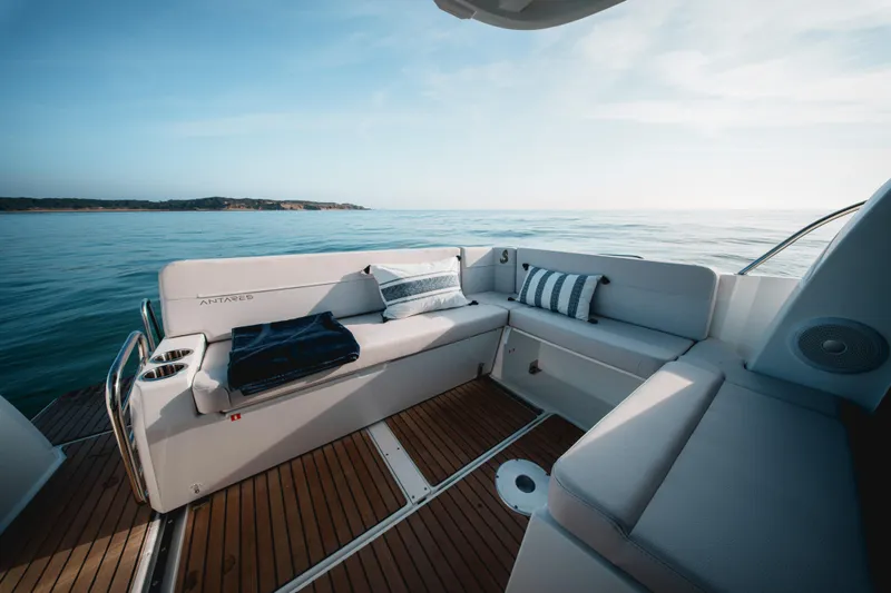 Slide: The Image of 2027 Beneteau Antares 9 V2 boat with elegant seating, ocean view, and wooden deck. - 8